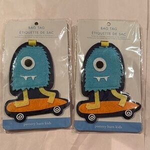 Two Pottery Barn Kids Blue and Orange mudpuppy Bag Tags